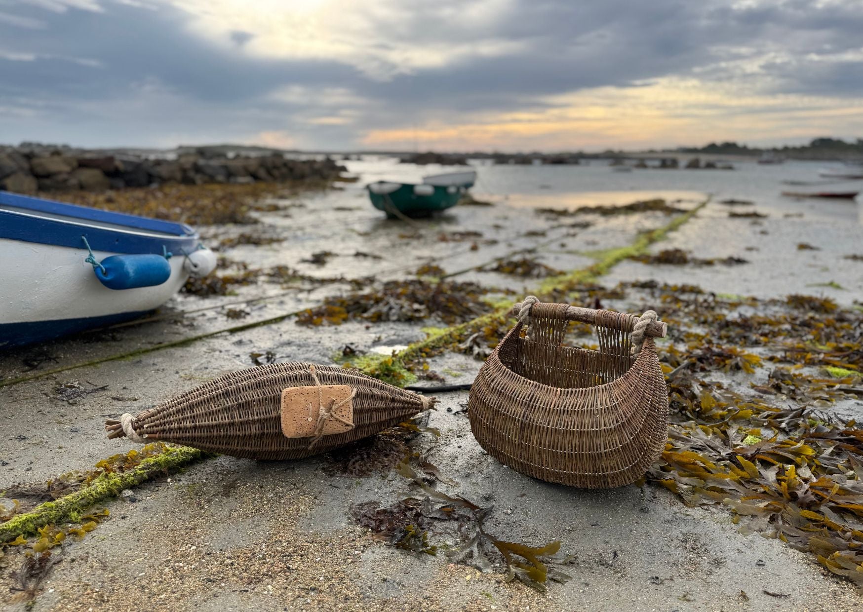 Claire Gaudion Guernsey willow fishing baskets on the beach at low tide