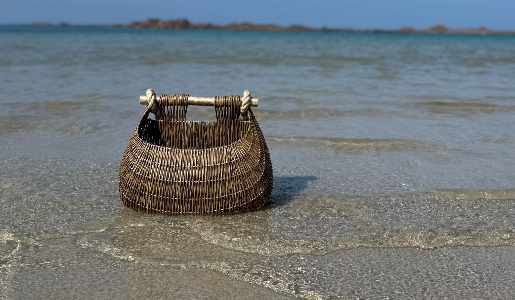 Guernsey basket on beach in the water